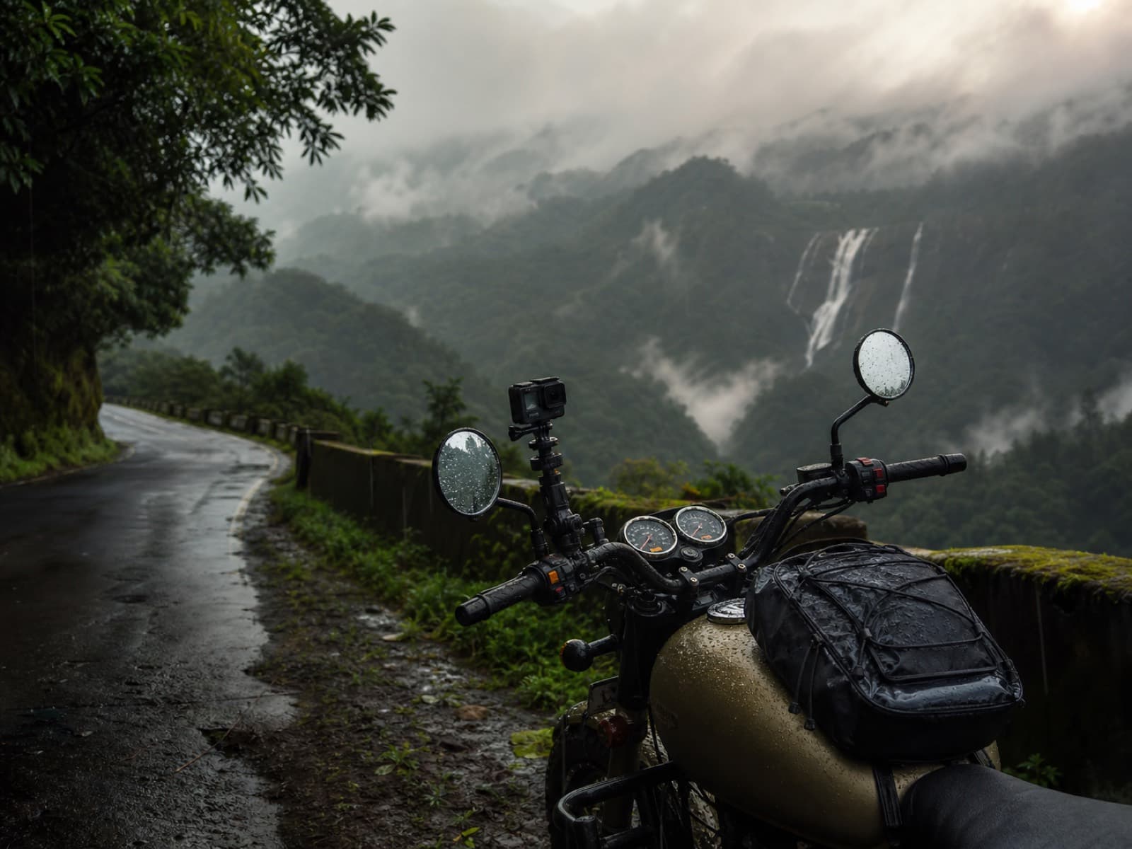 Travel video camera mounted on a motorcycle beside a misty Western Ghats monsoon road