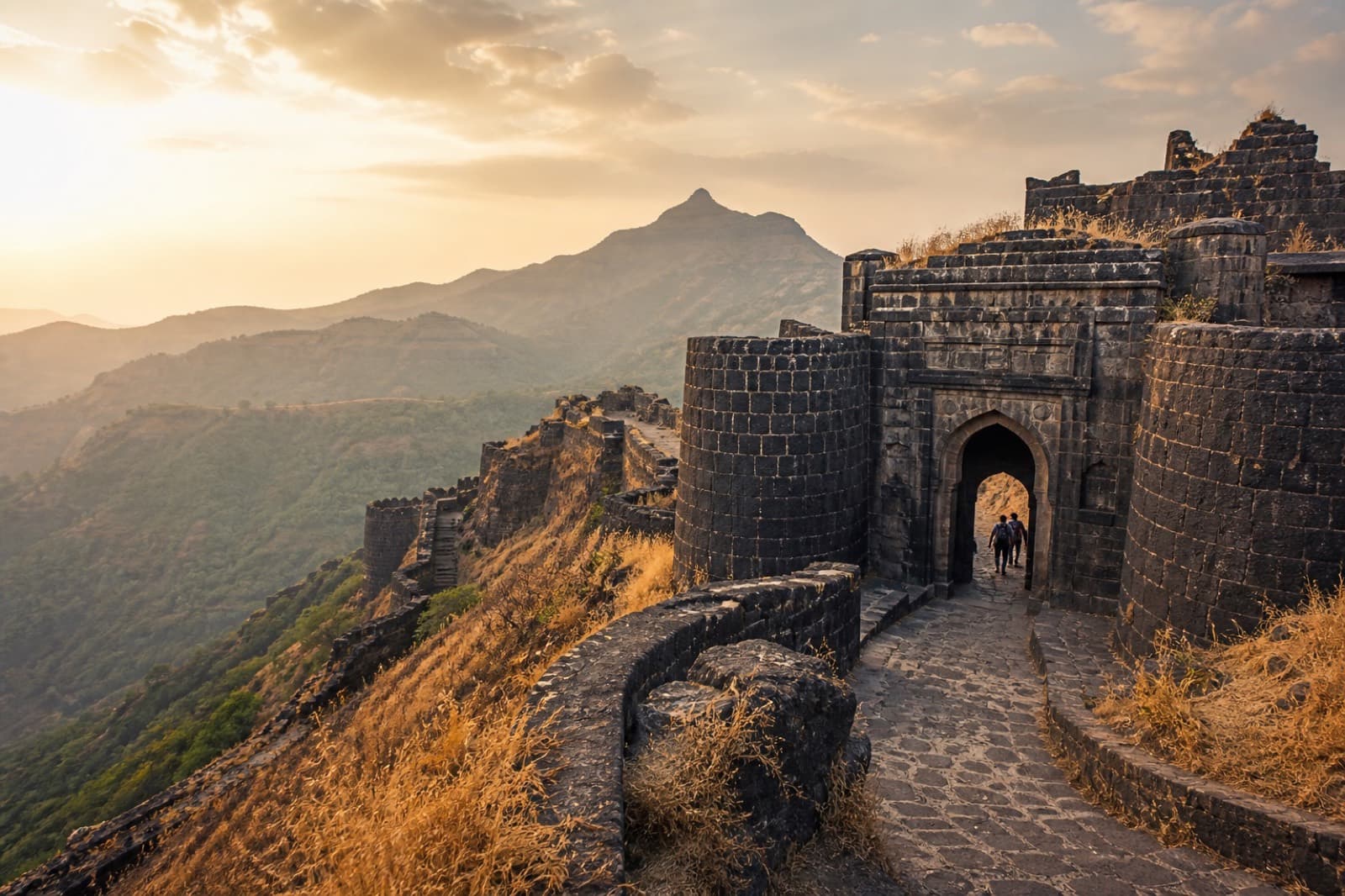 Basalt hill fort gateway in Maharashtra at golden hour