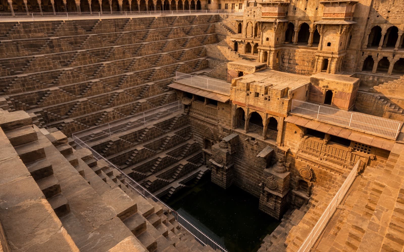 Symmetric stone steps descending into a historic Rajasthan stepwell