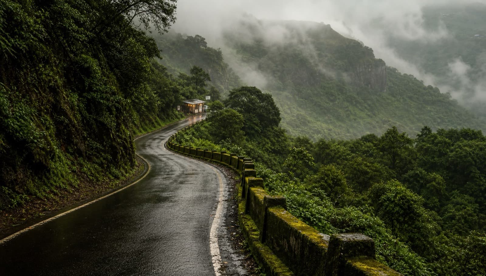 Wet winding ghat road through misty Sahyadri hills